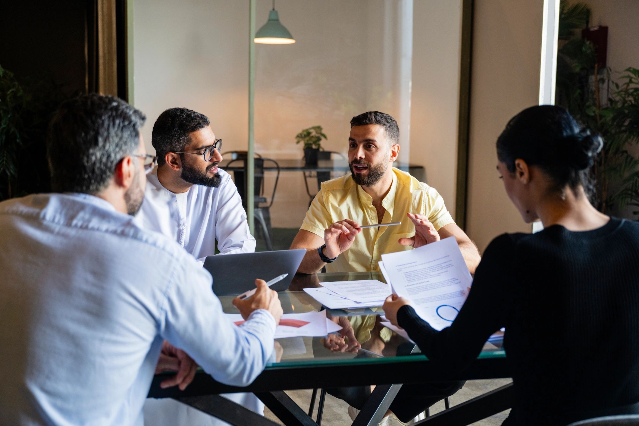 Business team reviewing documents in a strategy meeting